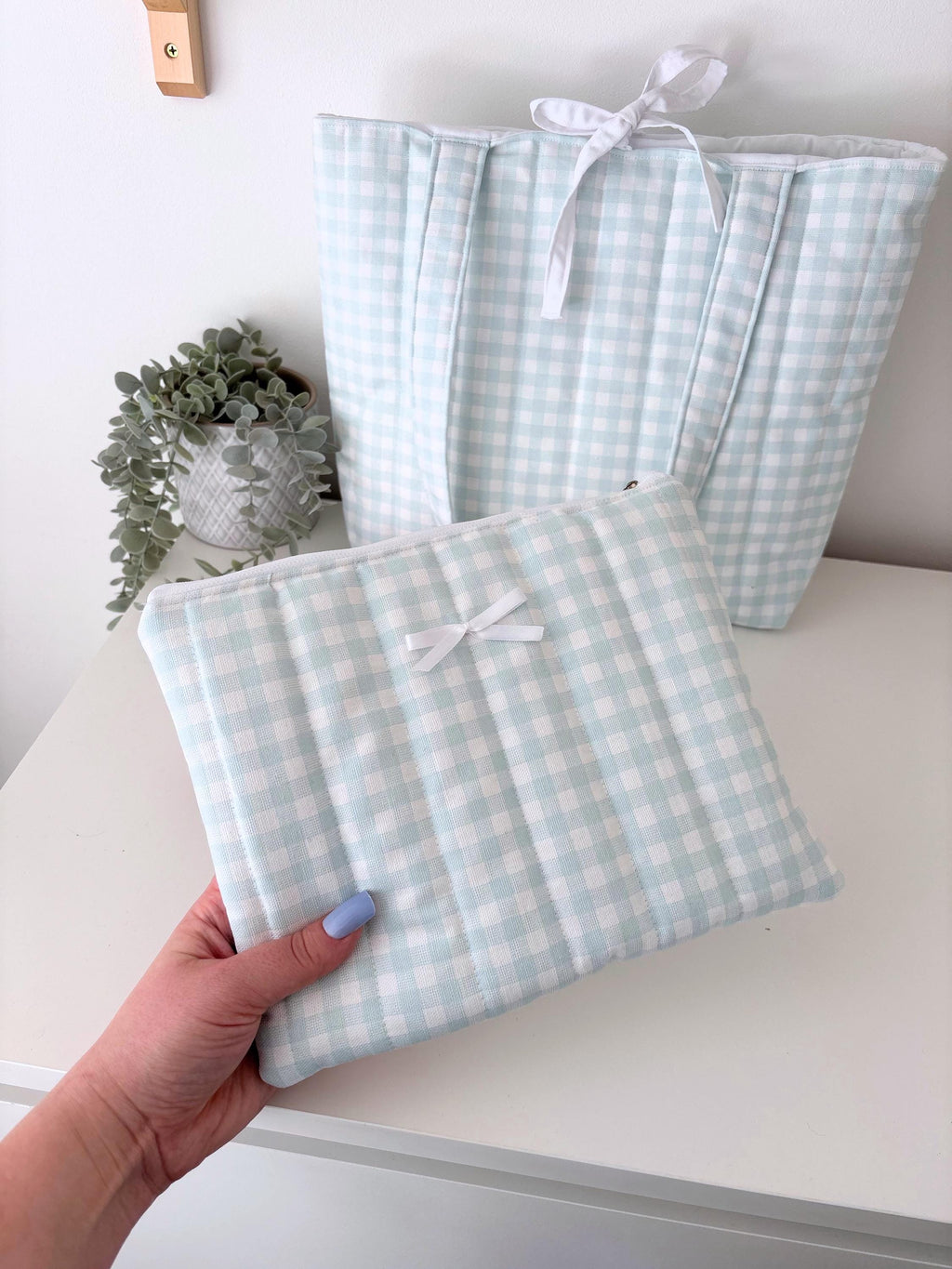 Pastel blue gingham quilted storage pouch