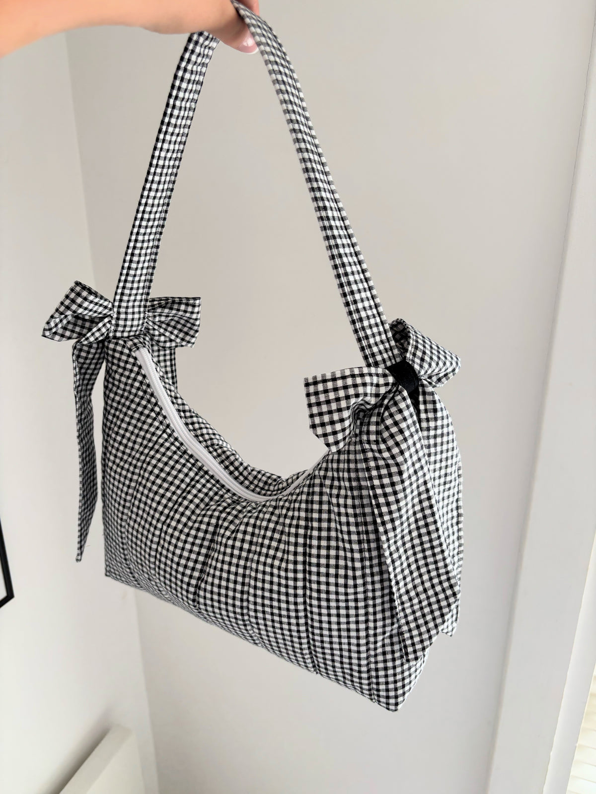 Black and white gingham quilted bow shoulder bag