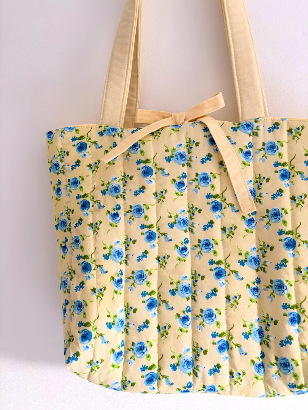 Pastel yellow and blue floral quilted tote bag