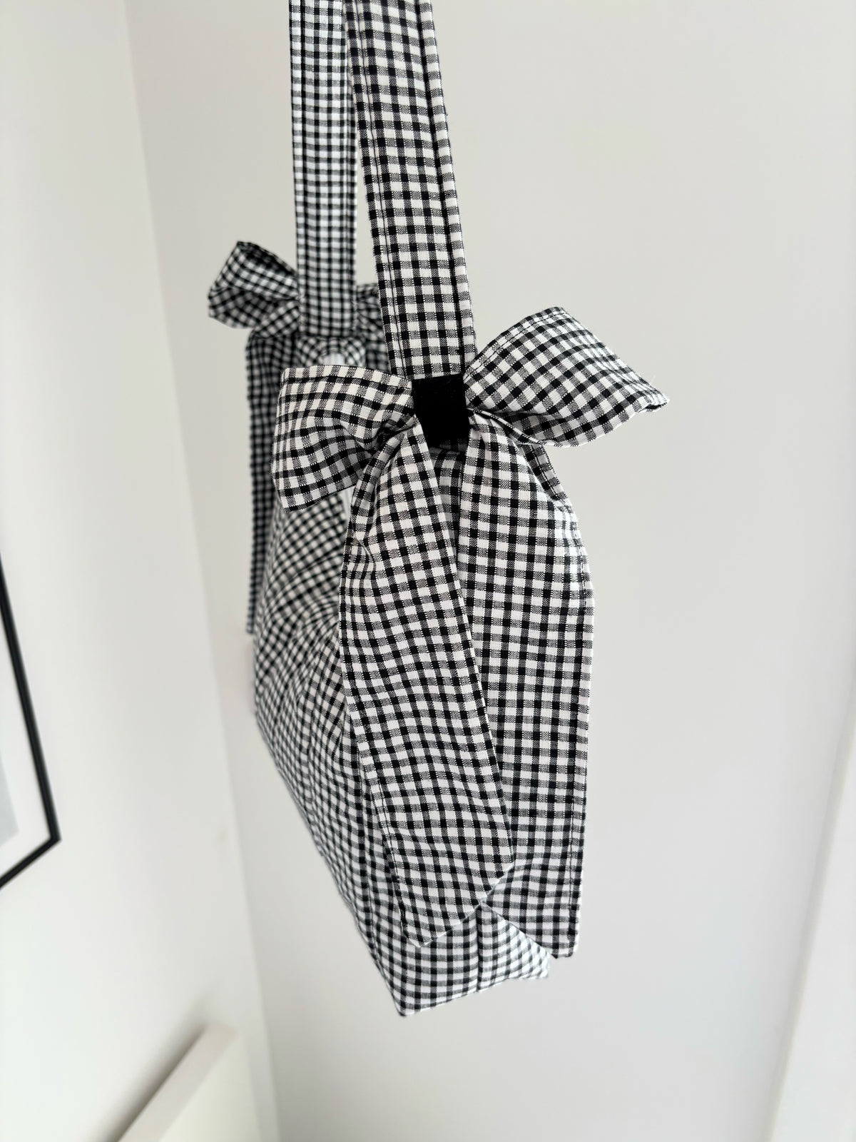 Black and white gingham quilted bow shoulder bag