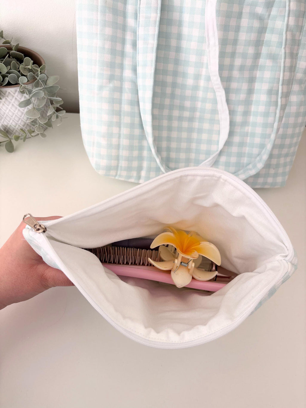 Pastel blue gingham quilted storage pouch