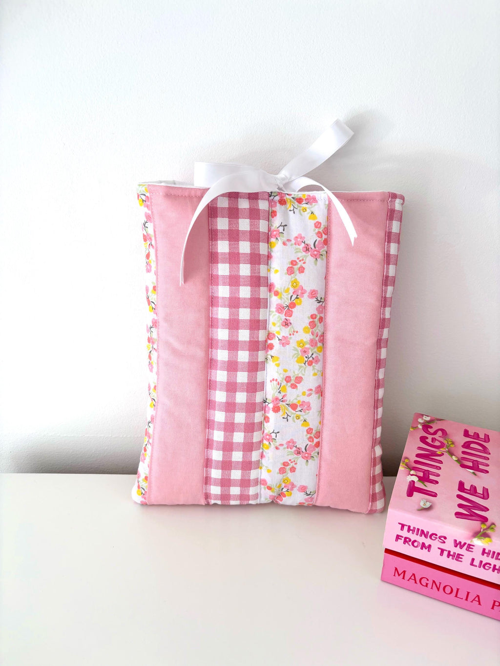 Pink patchwork quilted book sleeve