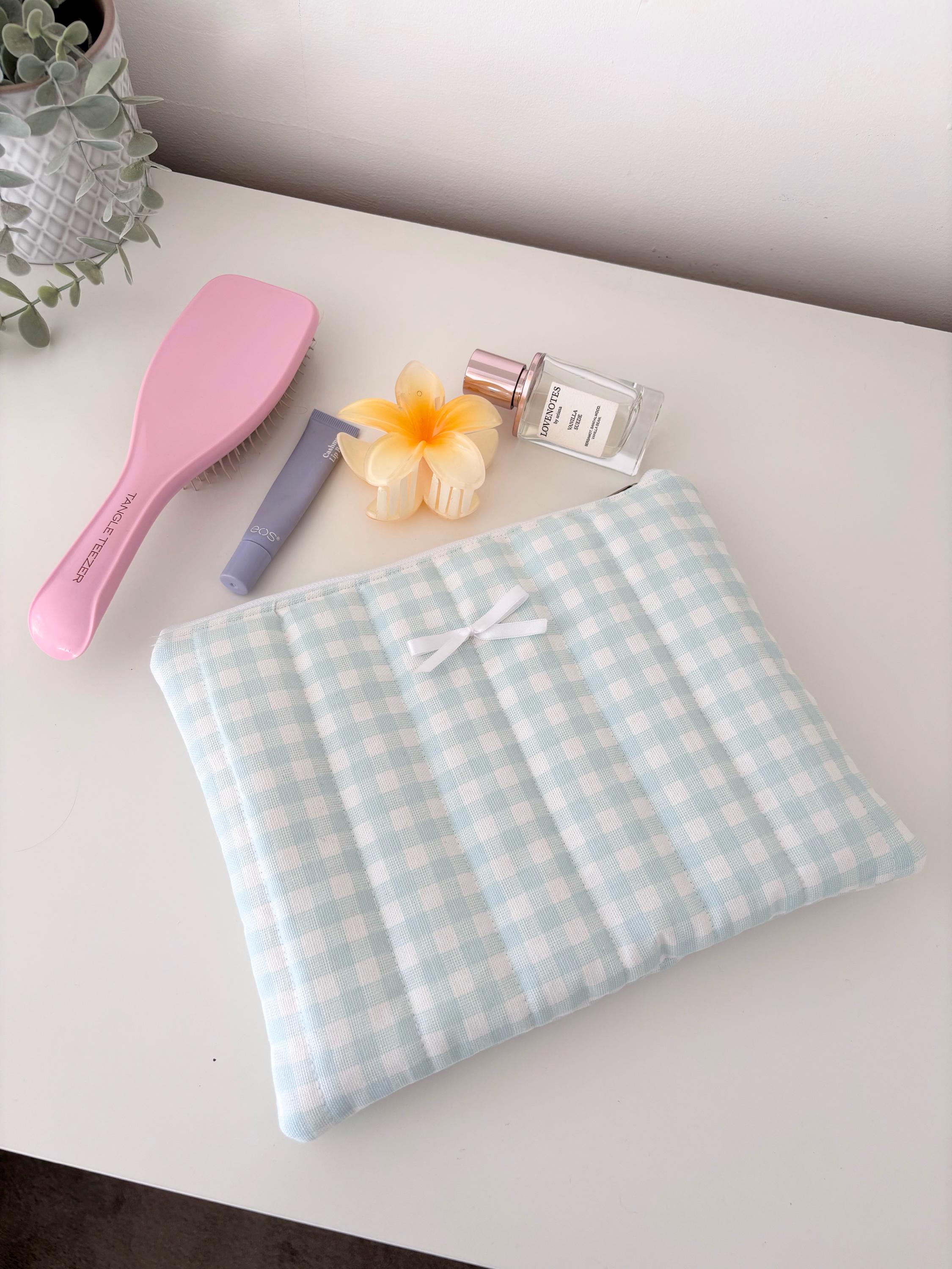 Pastel blue gingham quilted storage pouch