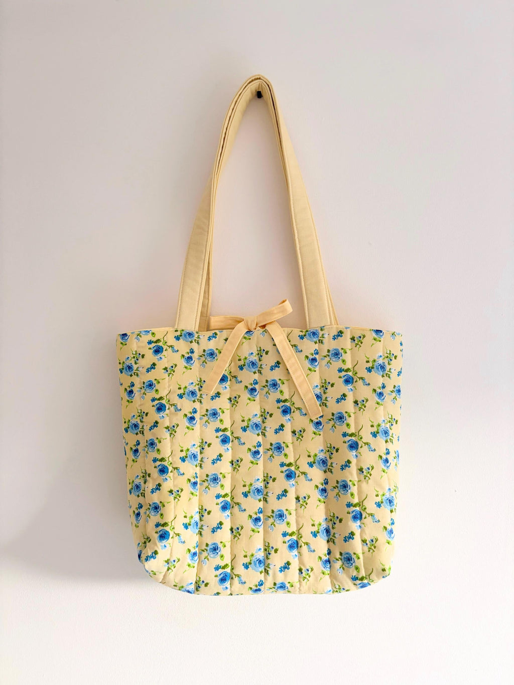 Pastel yellow and blue floral quilted tote bag