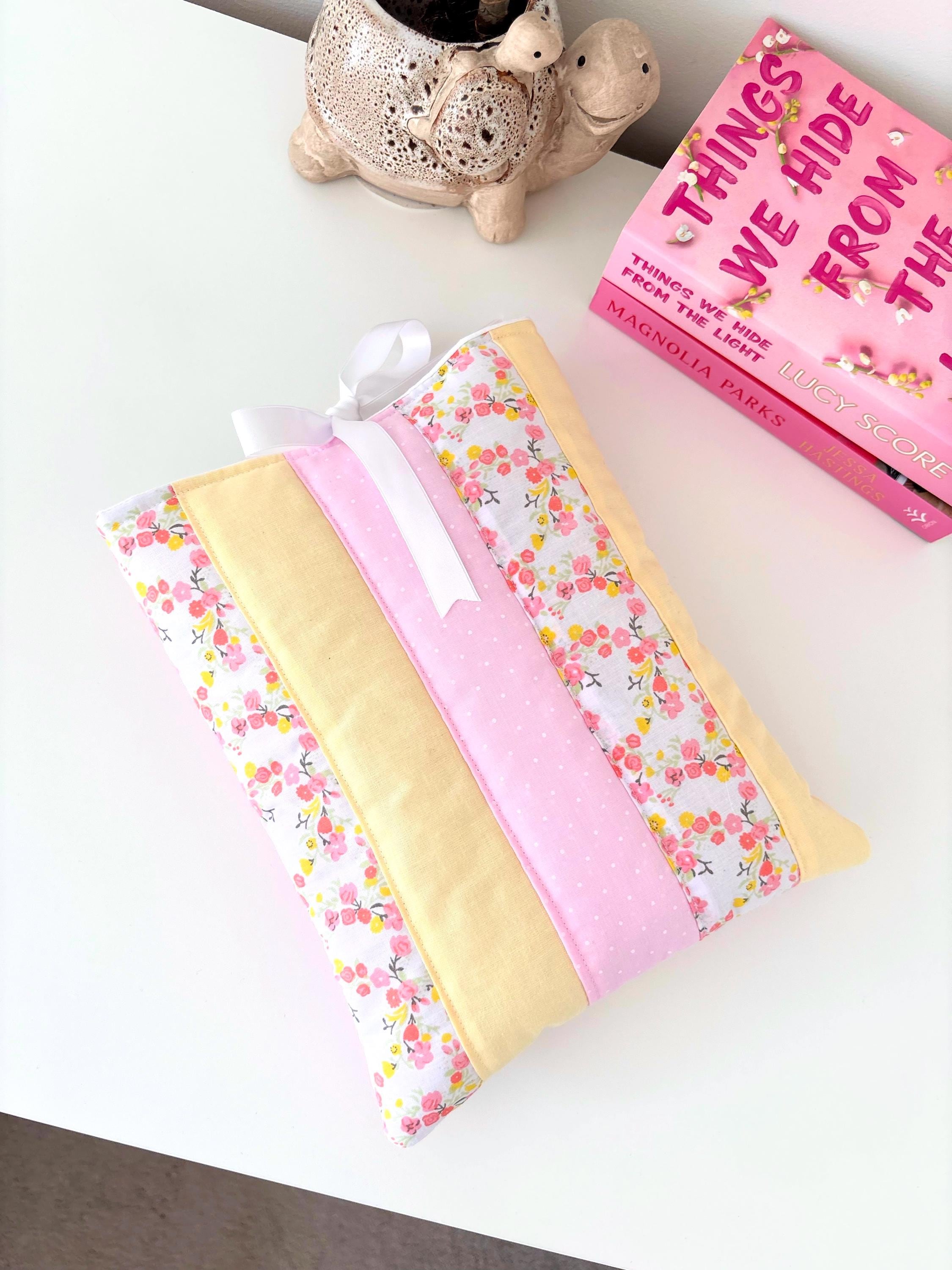 Pastel pink and yellow patchwork quilted book sleeve