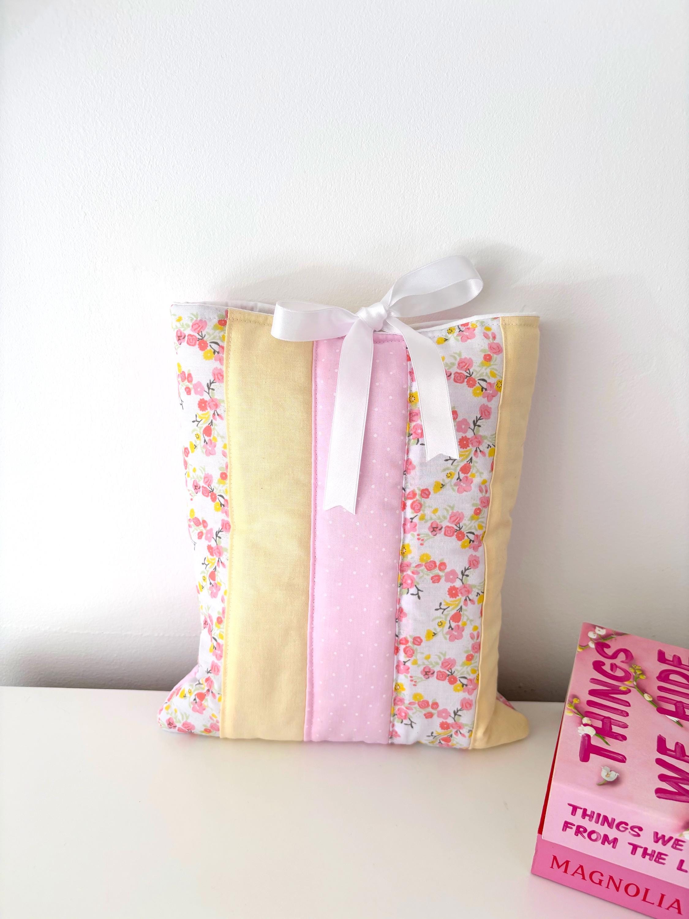 Pastel pink and yellow patchwork quilted book sleeve