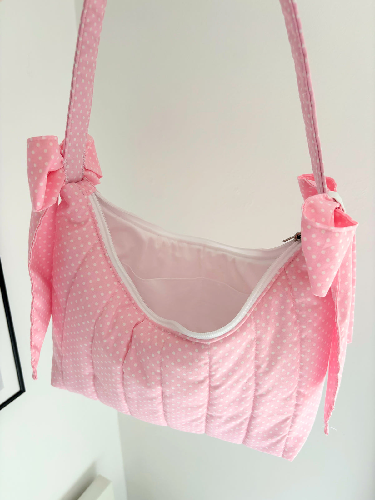 Pink polka dot quilted bow shoulder bag