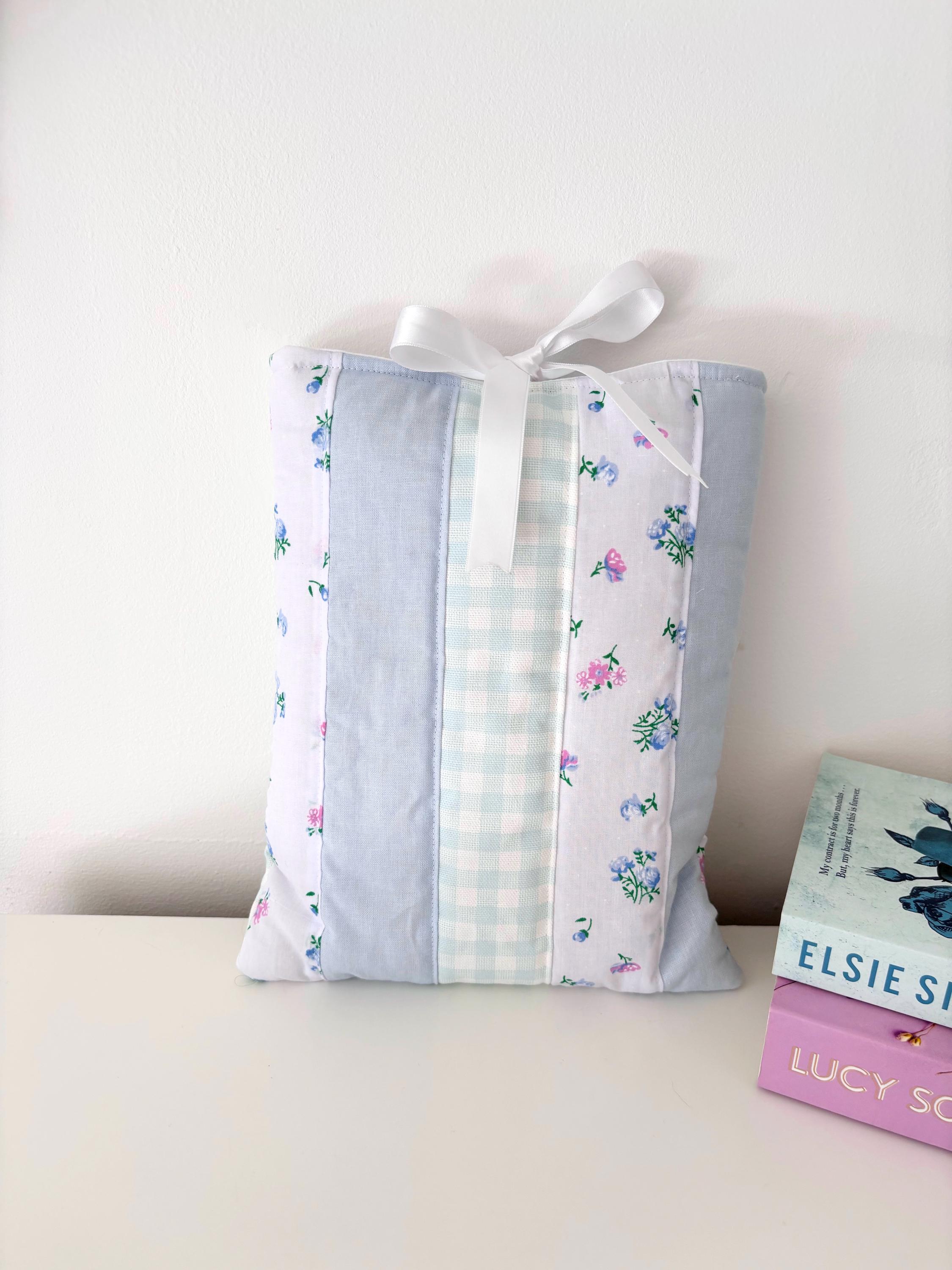 Pastel blue patchwork quilted book sleeve