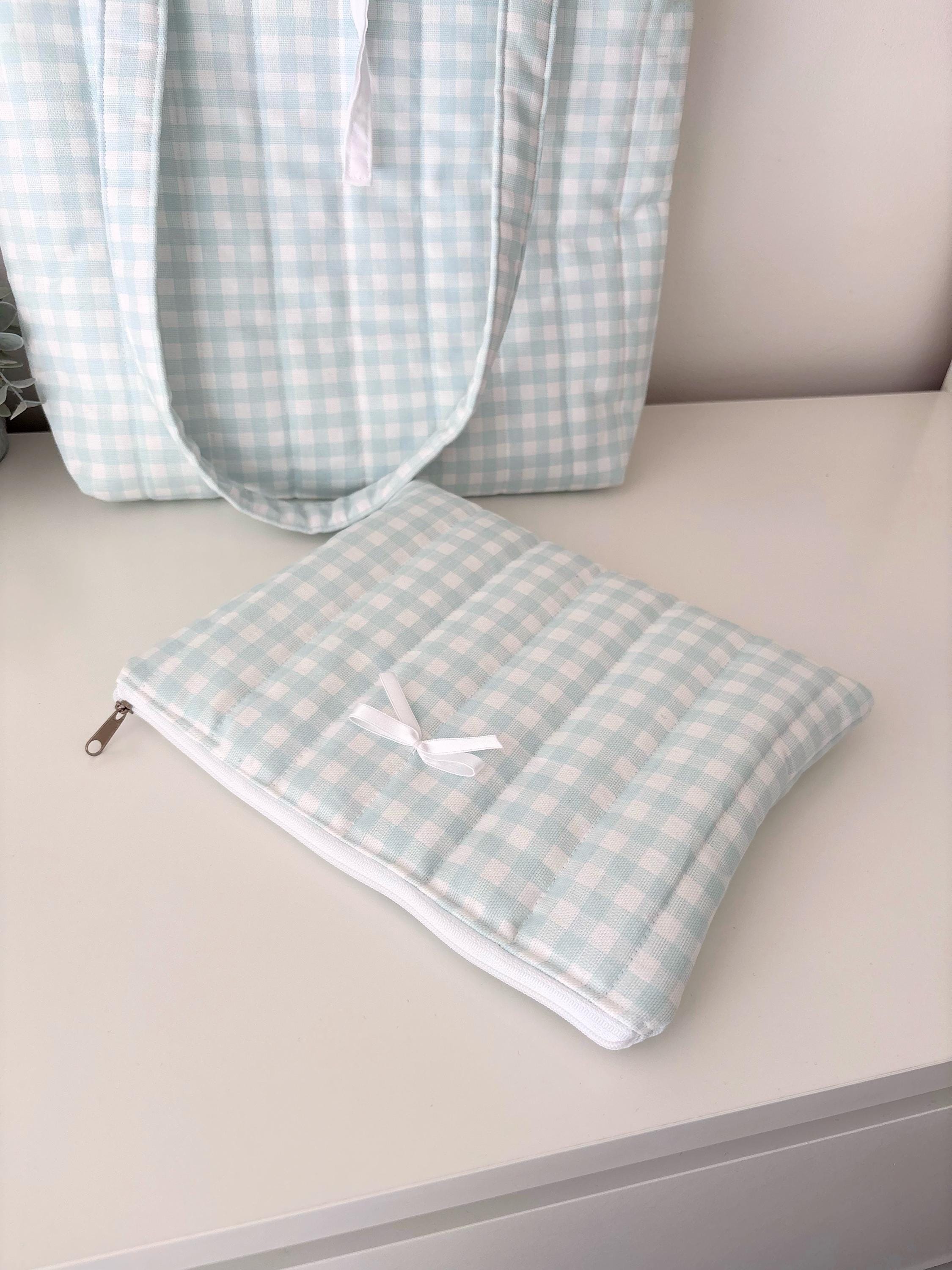 Pastel blue gingham quilted storage pouch