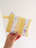 Small quilted yellow patchwork pouch