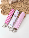 Pastel / gingham / floral wristlet