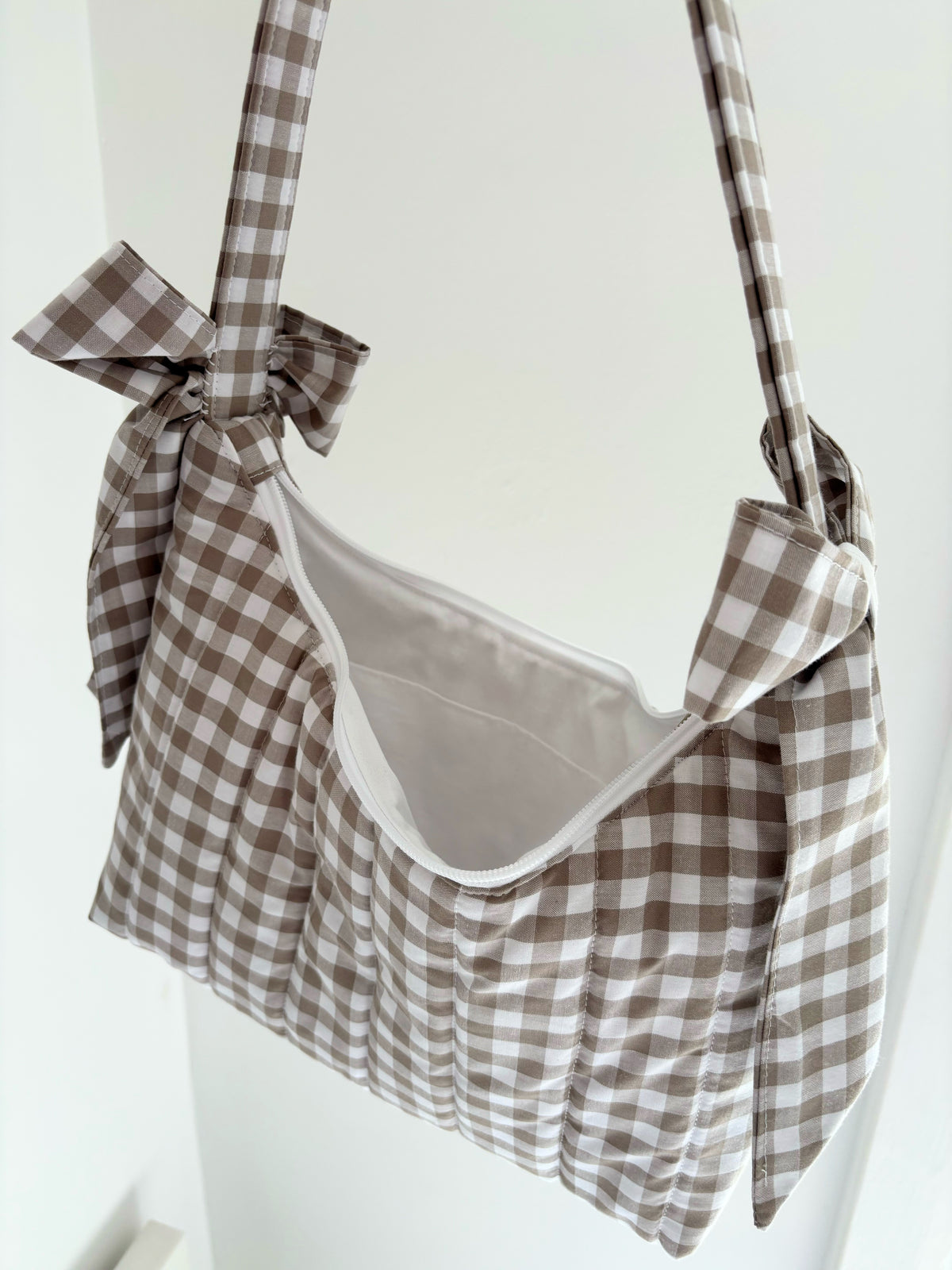 Beige gingham quilted bow shoulder bag