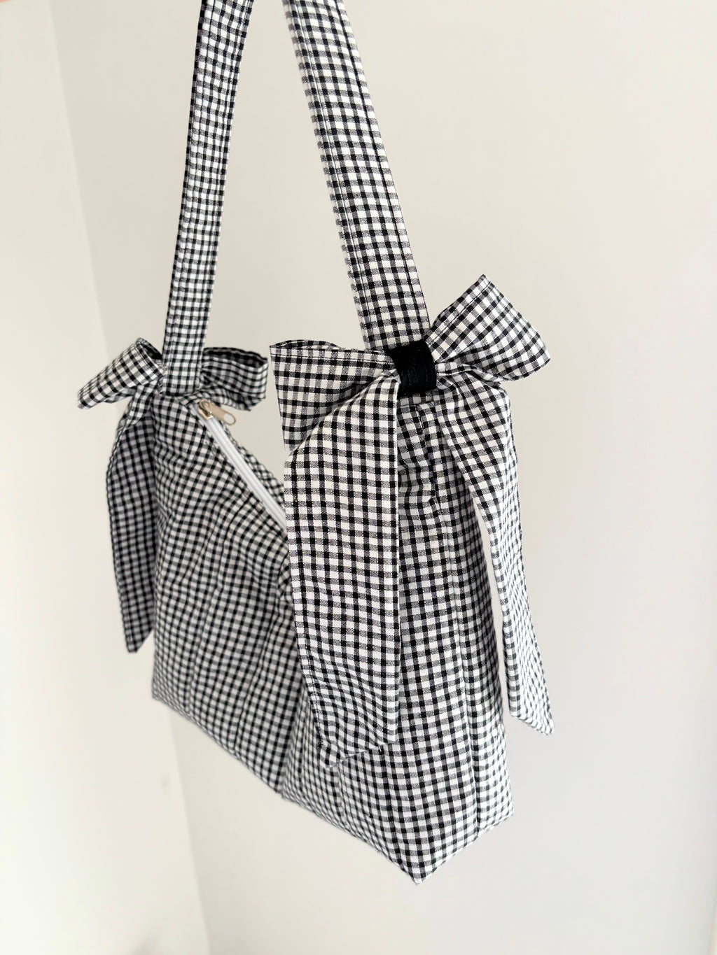 Black and white gingham quilted bow shoulder bag