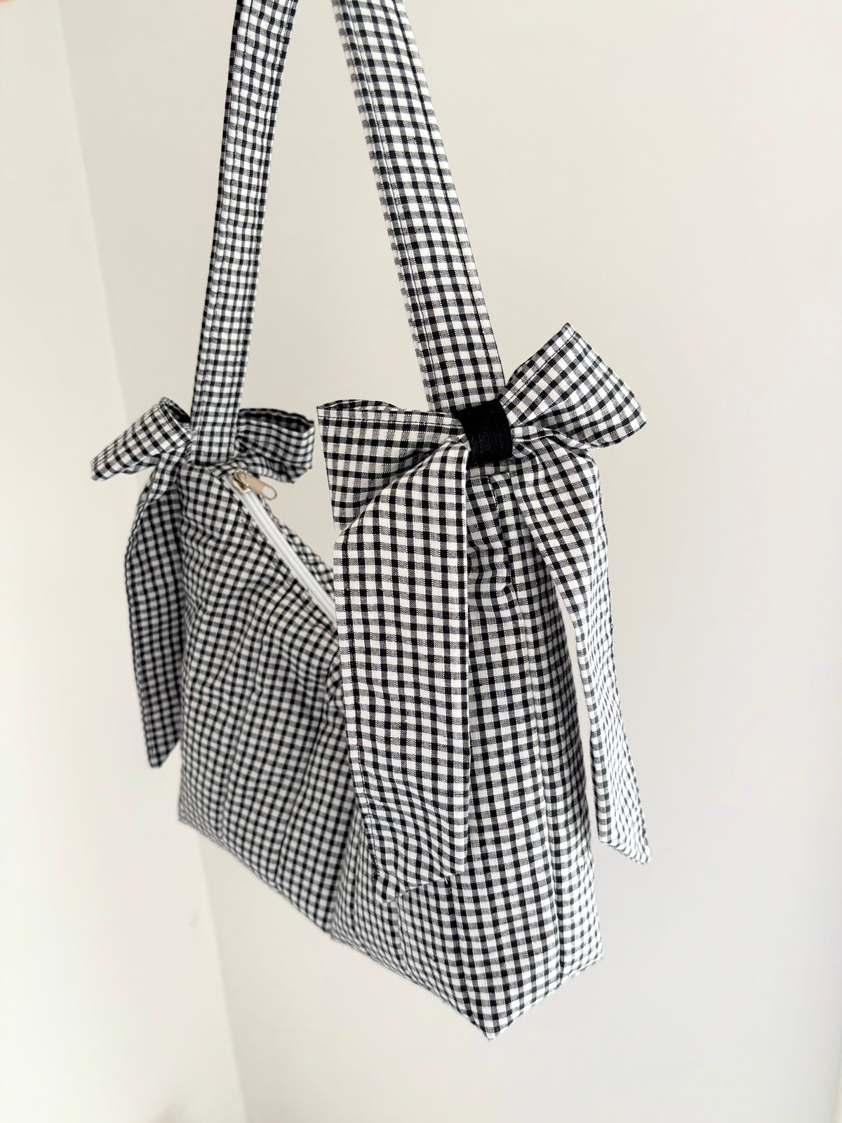 Black and white gingham quilted bow shoulder bag