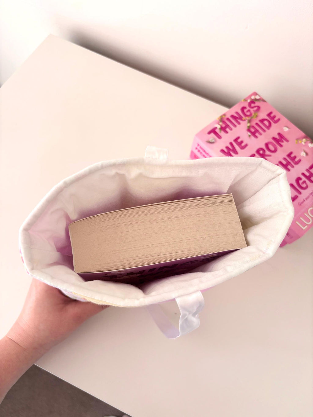 Pastel pink and yellow patchwork quilted book sleeve