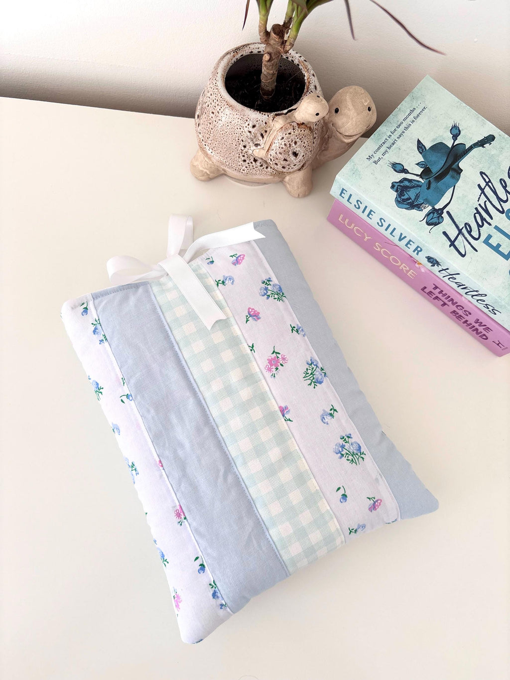 Pastel blue patchwork quilted book sleeve