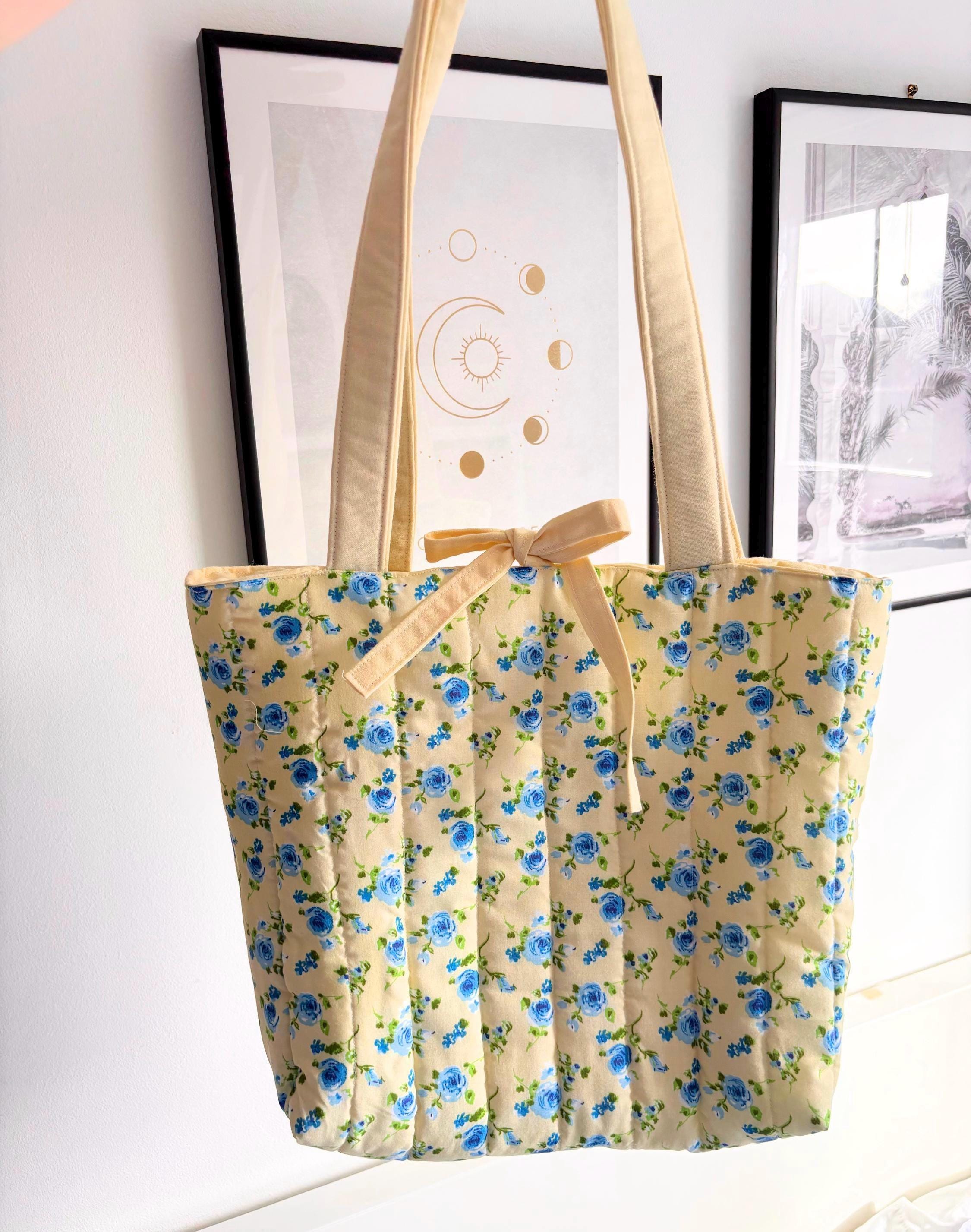 Pastel yellow and blue floral quilted tote bag