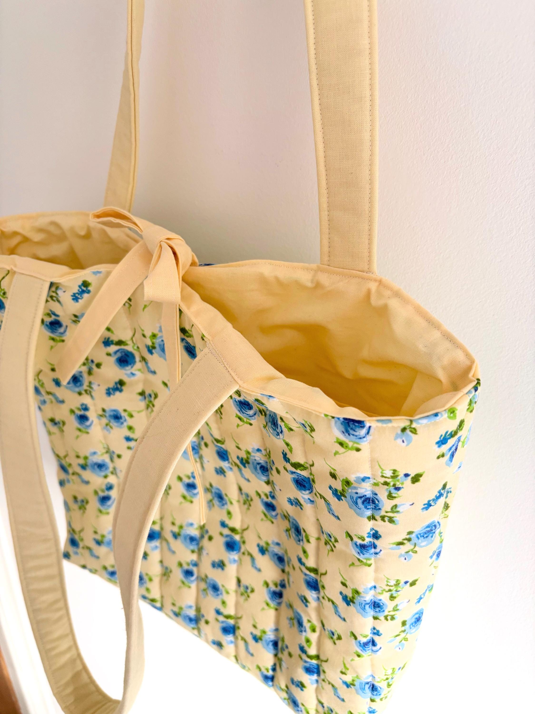 Pastel yellow and blue floral quilted tote bag