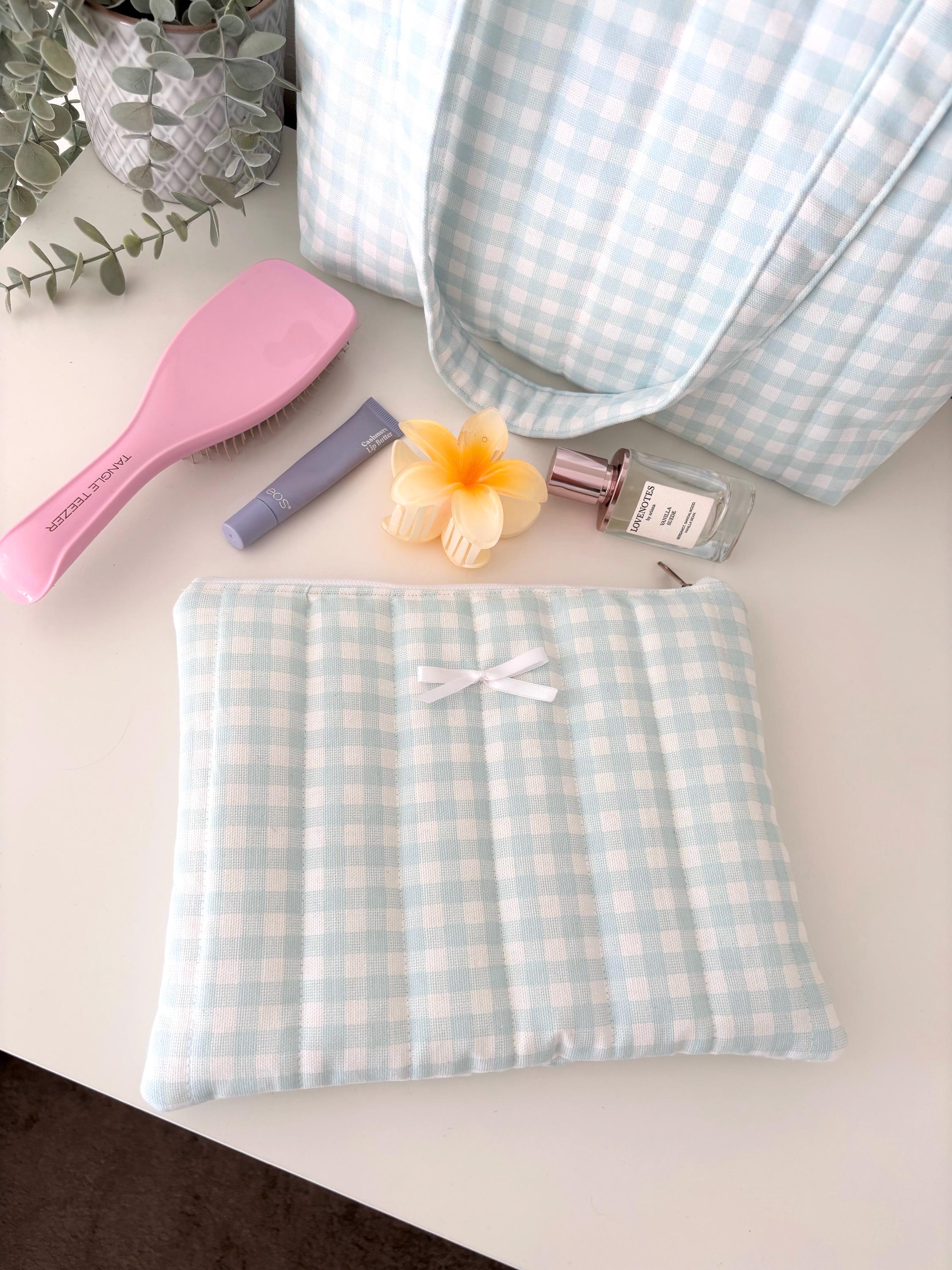 Pastel blue gingham quilted storage pouch
